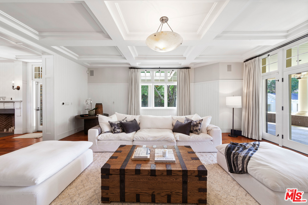 6763 Zumirez Drive Malibu, CA 90265 - Photo 9 of 52 a bedroom with a bed and a chandelier