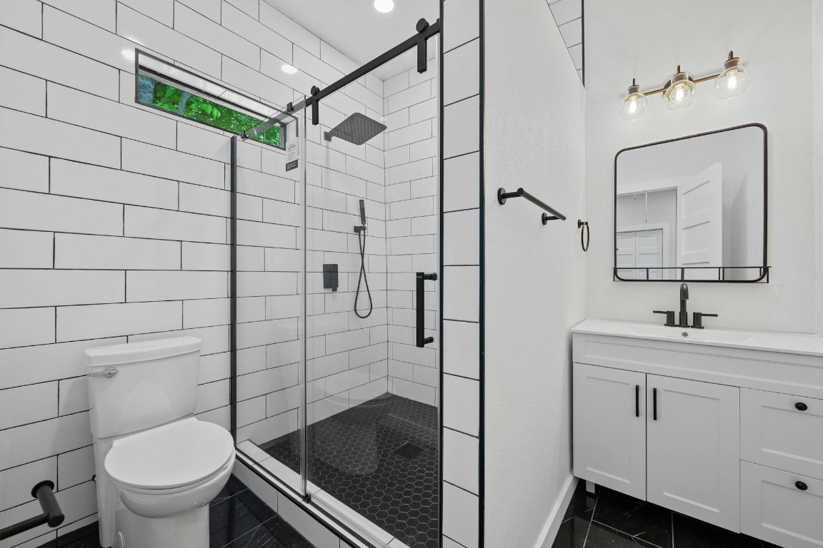 914 East 50th Street Austin, TX 78751 - Photo 15 of 27 Primary bath also has a walk-in-shower and natural light