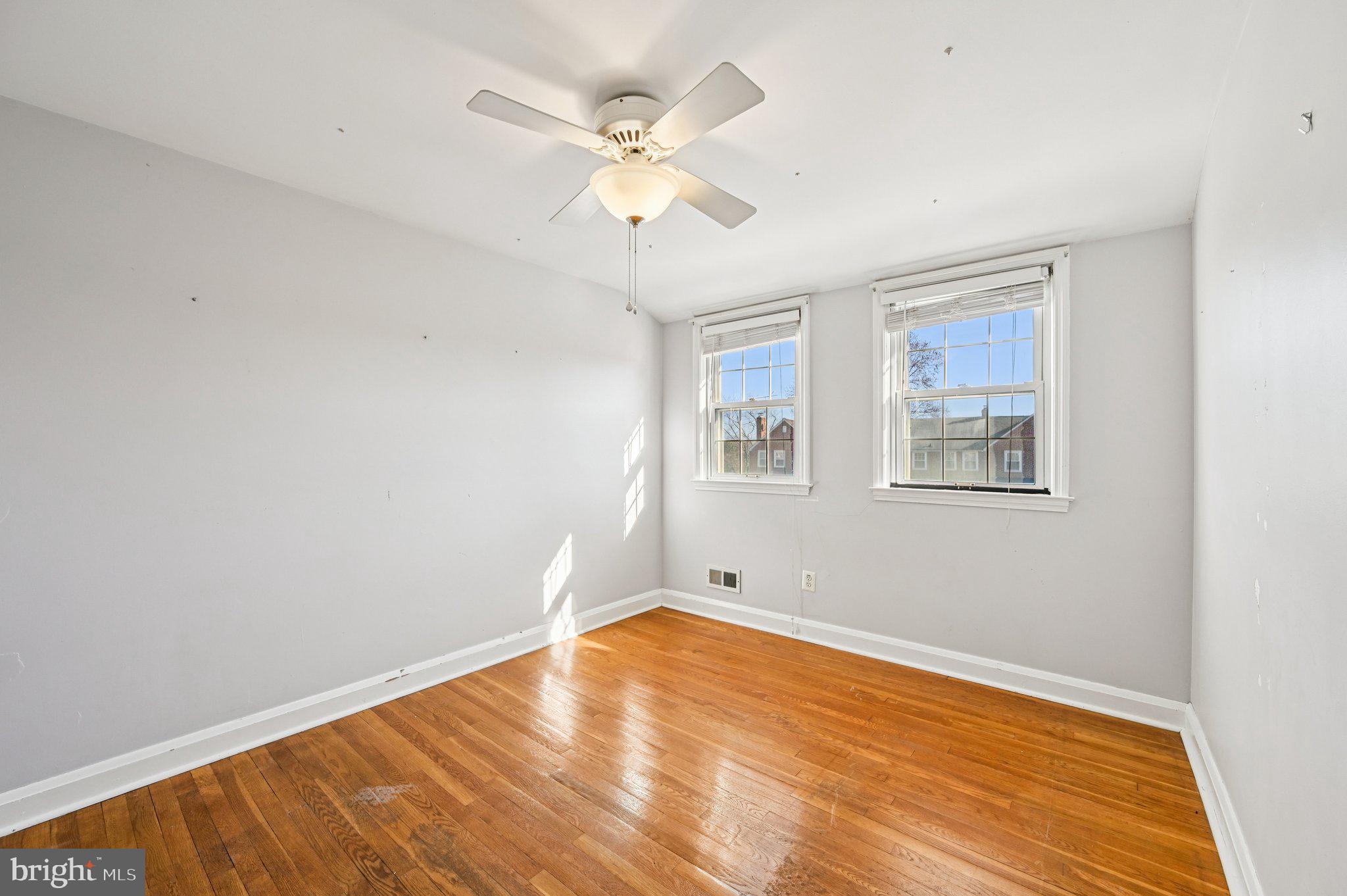 8334 Wyton Road Baltimore, MD 21286 - Photo 17 of 44 wooden floor in an empty room with a window