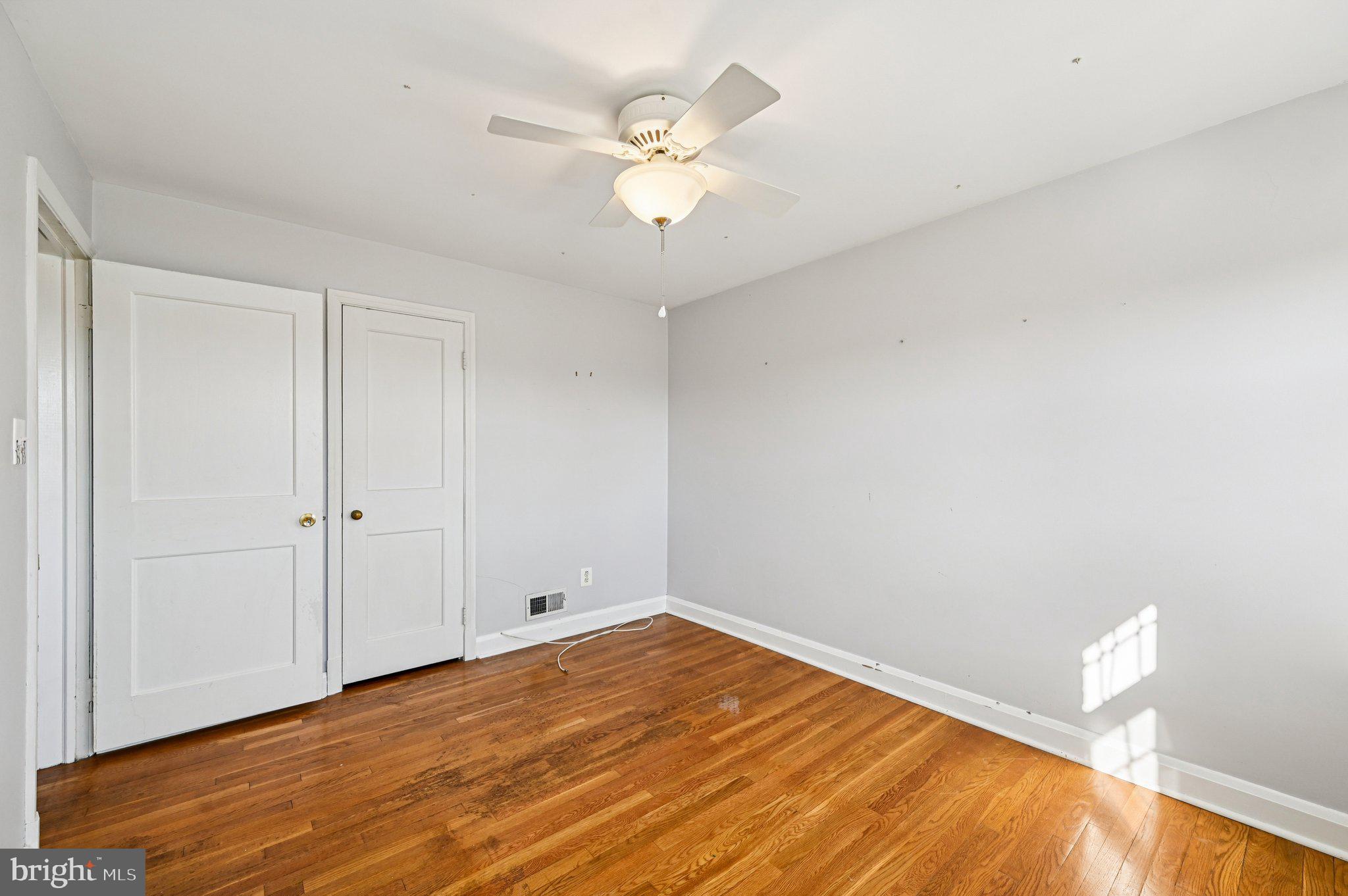 8334 Wyton Road Baltimore, MD 21286 - Photo 20 of 44 a view of an empty room with wooden floor