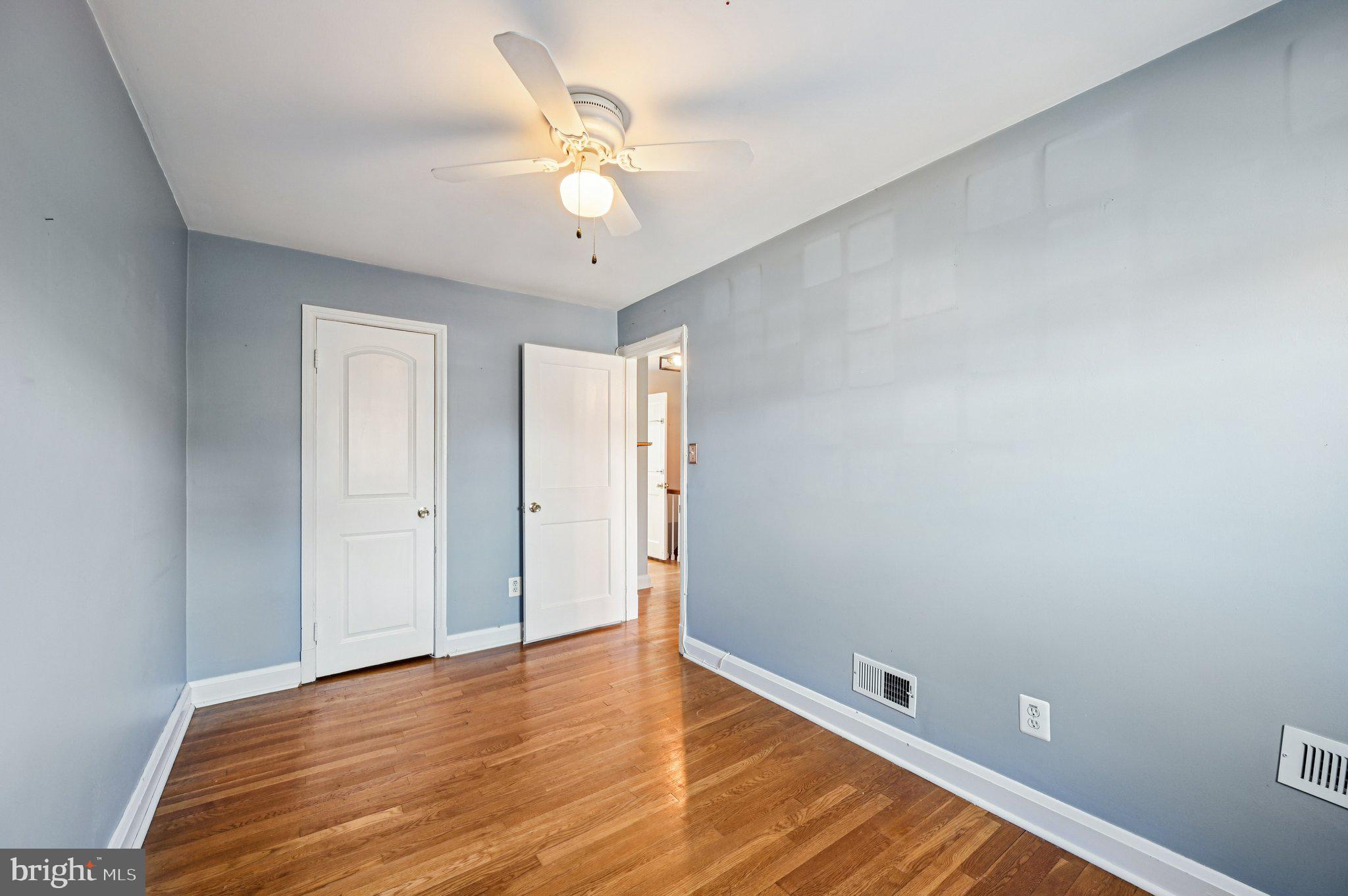 8334 Wyton Road Baltimore, MD 21286 - Photo 23 of 44 a view of an empty room with wooden floor