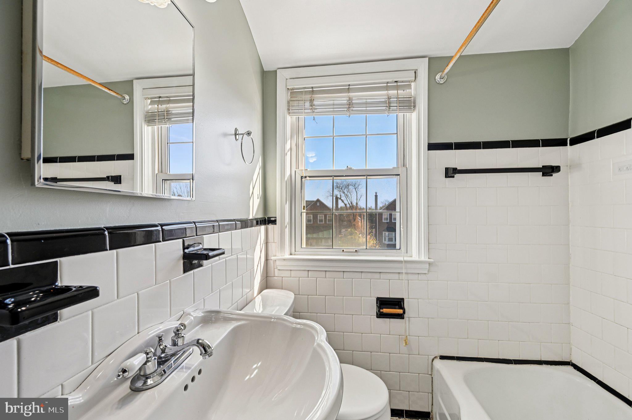 8334 Wyton Road Baltimore, MD 21286 - Photo 24 of 44 a bathroom with a sink a toilet and shower