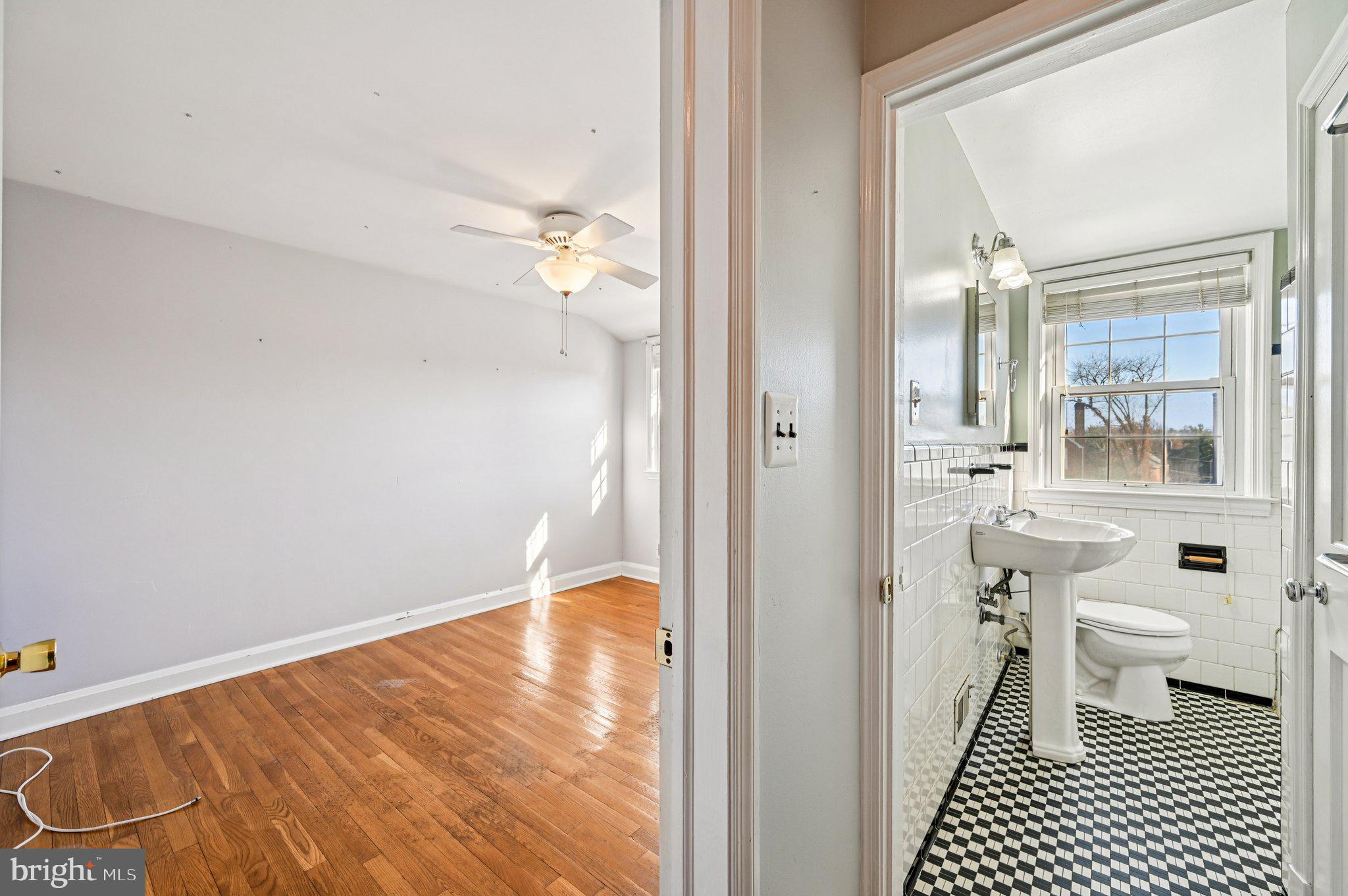 8334 Wyton Road Baltimore, MD 21286 - Photo 26 of 44 a bathroom with a sink and a mirror