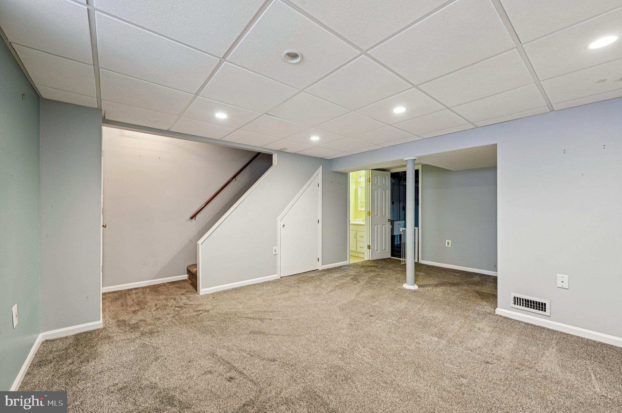 8334 Wyton Road Baltimore, MD 21286 - Photo 31 of 44 a view of an empty room with wooden floor