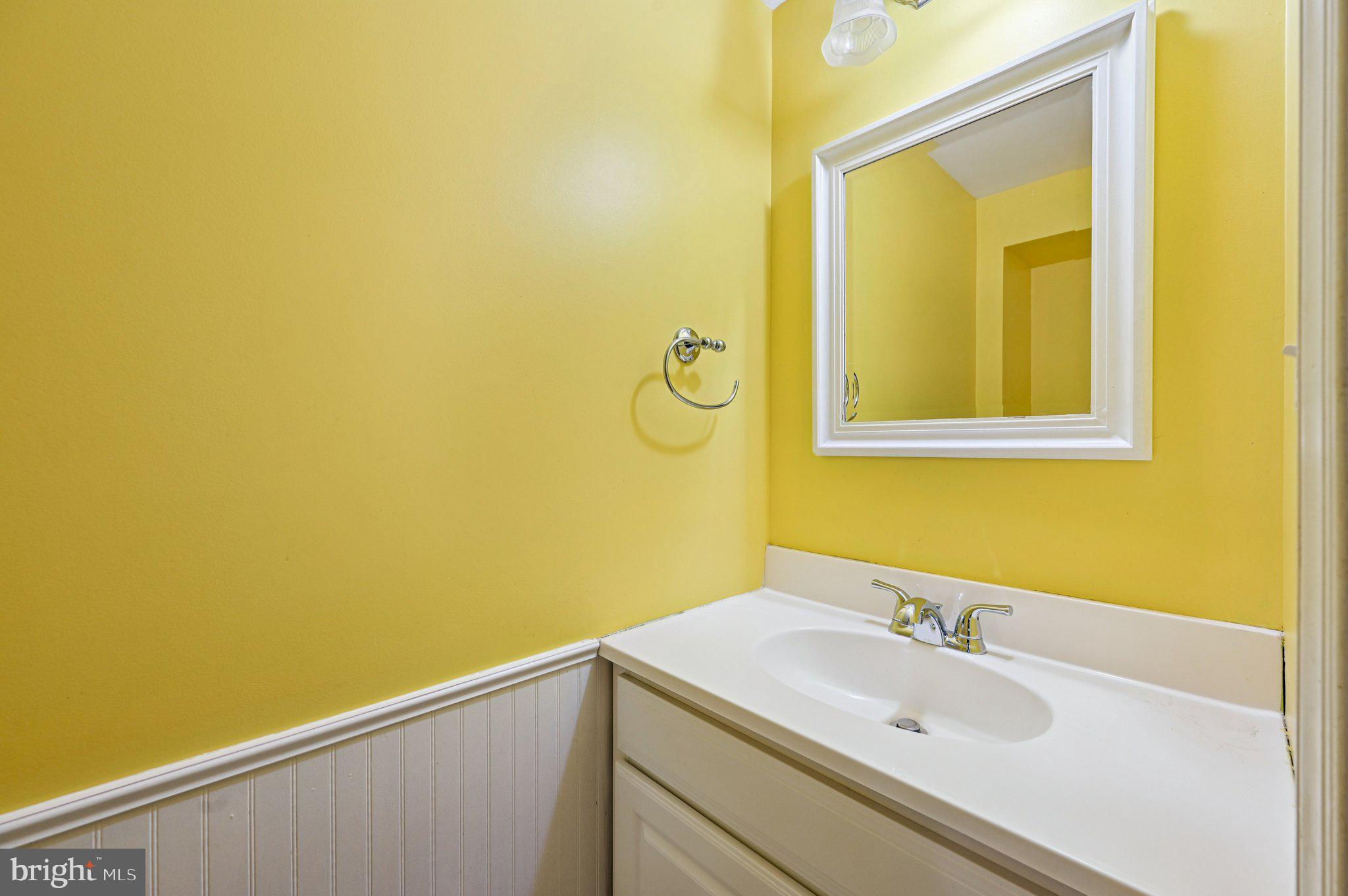8334 Wyton Road Baltimore, MD 21286 - Photo 34 of 44 a bathroom with a sink and a mirror