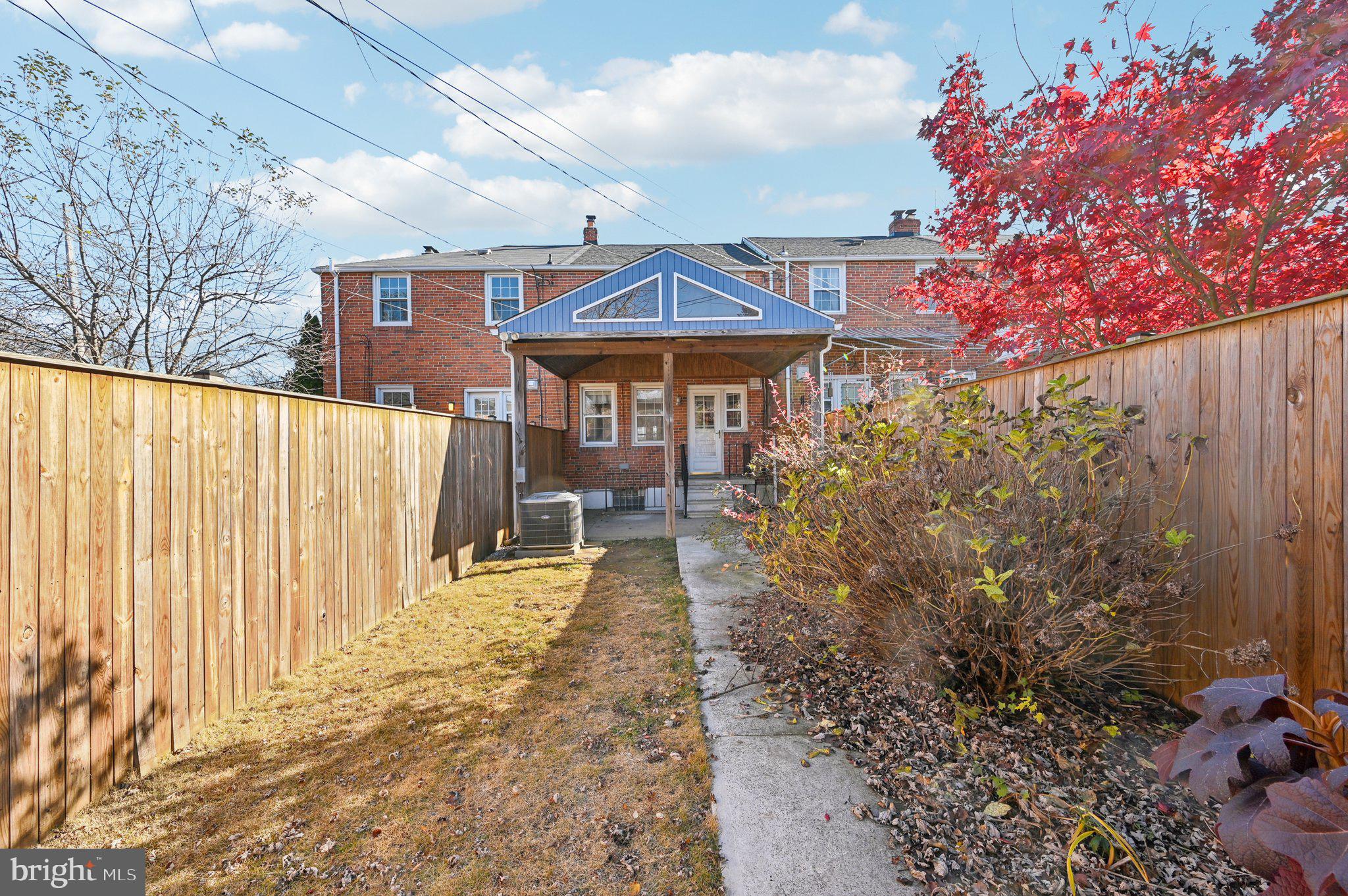 8334 Wyton Road Baltimore, MD 21286 - Photo 40 of 44 a front view of a house with a yard