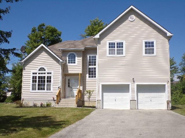 46 Hibbing Way Newburgh, NY 12550 - Photo 1 of 1 a front view of a house with a yard and garage