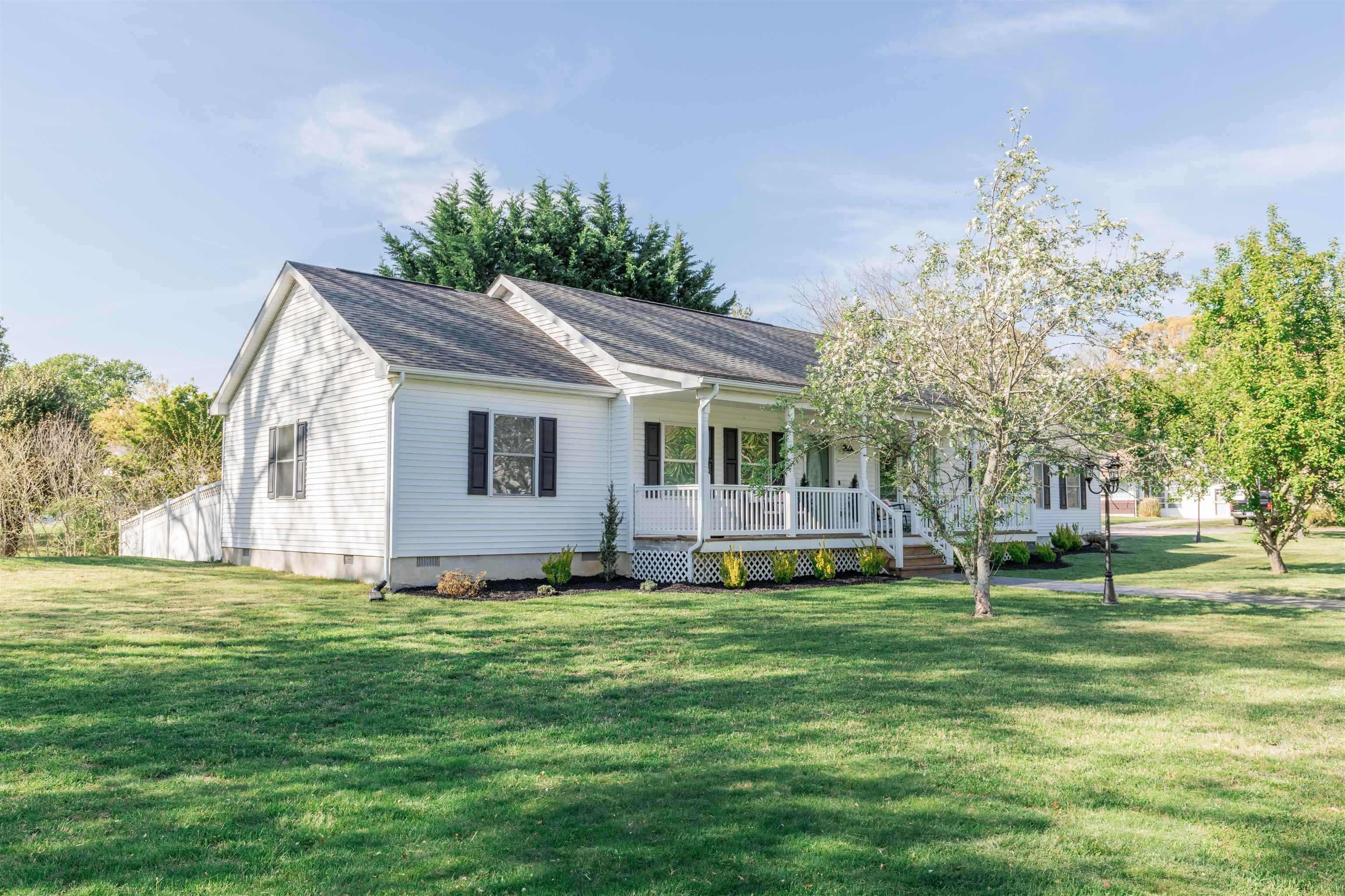 933 Main Street Erma, NJ 08204 - Photo 1 of 24 a front view of house with yard and green space