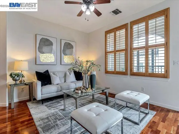 a bathroom with a toilet and a shower curtain