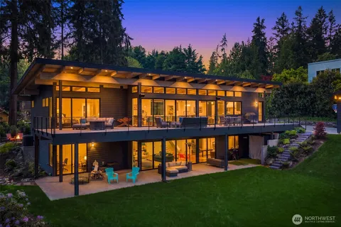 a large kitchen with a large window and stainless steel appliances