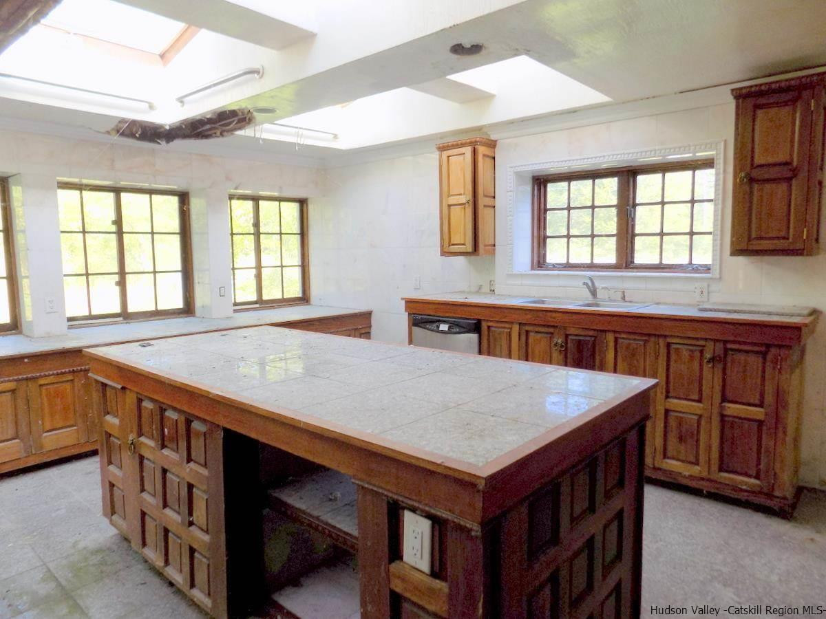 2733 Highway 209 Kingston, NY 12401 - Photo 14 of 34 a view of kitchen with center island and wooden floor