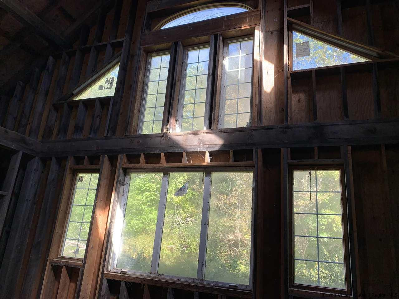2733 Highway 209 Kingston, NY 12401 - Photo 32 of 34 a view of a house with a large window and outdoor space