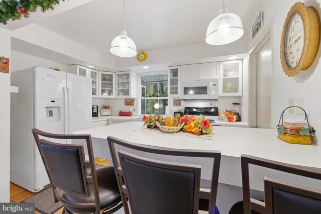 a kitchen with a stove and a refrigerator
