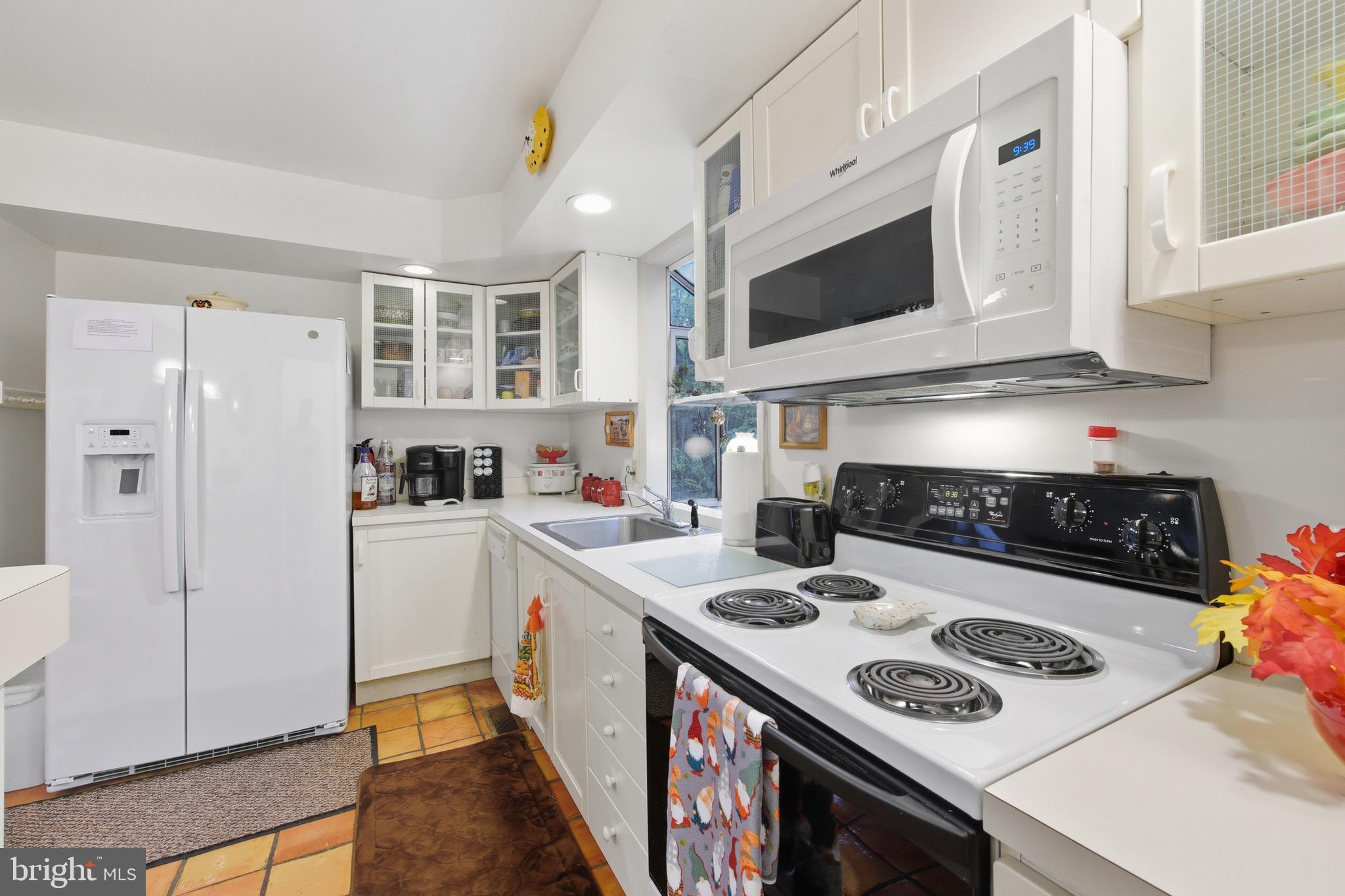 16 Spruce Hollow Road Basye, VA 22842 - Photo 23 of 50 a kitchen with a stove and a refrigerator