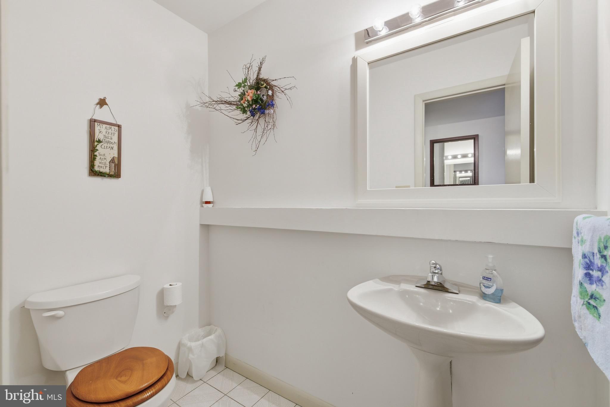 16 Spruce Hollow Road Basye, VA 22842 - Photo 27 of 50 a bathroom with a toilet sink and mirror