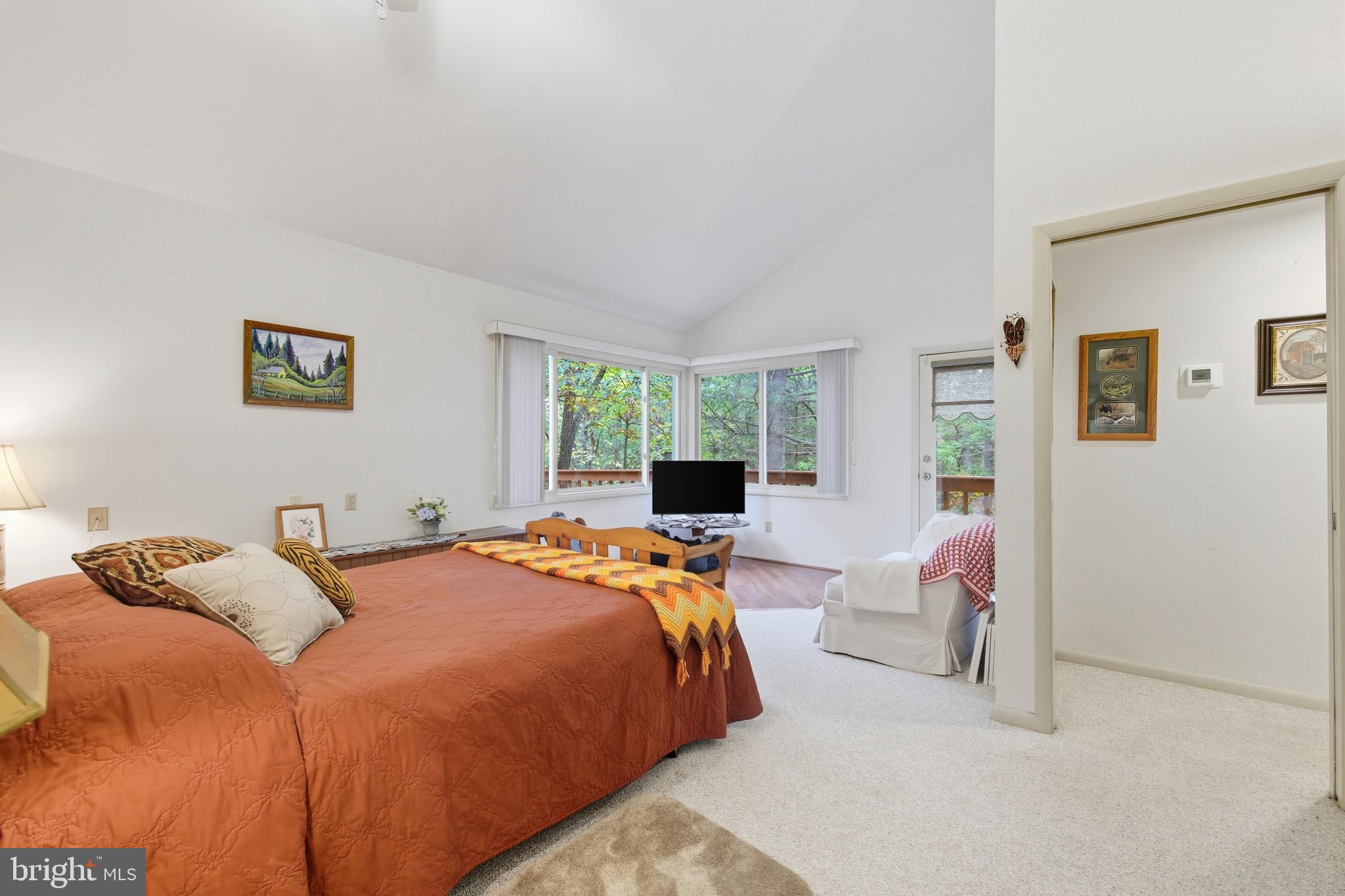 16 Spruce Hollow Road Basye, VA 22842 - Photo 31 of 50 a bedroom with a bed and wooden floor