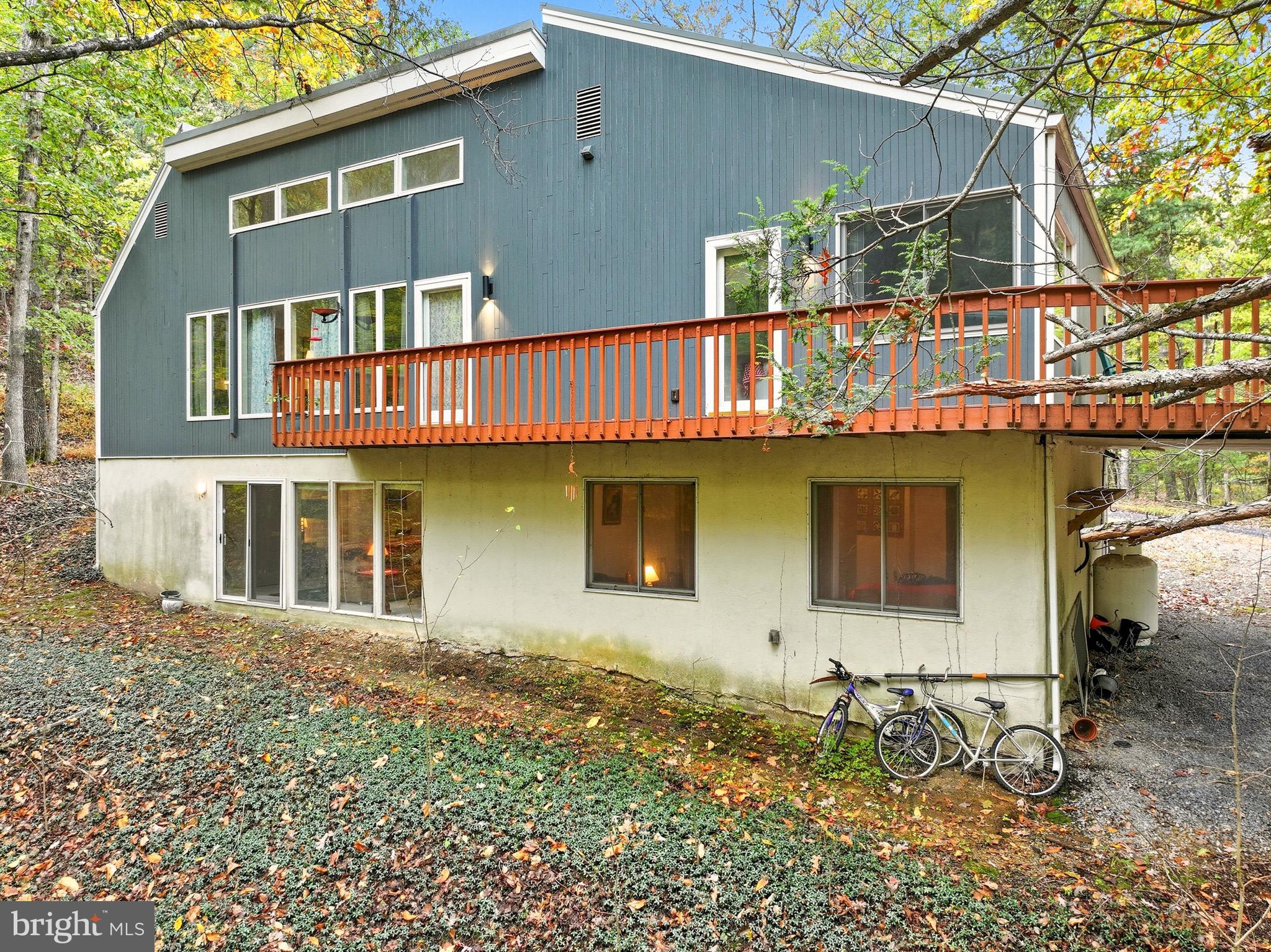 16 Spruce Hollow Road Basye, VA 22842 - Photo 5 of 50 a front view of a house with large windows