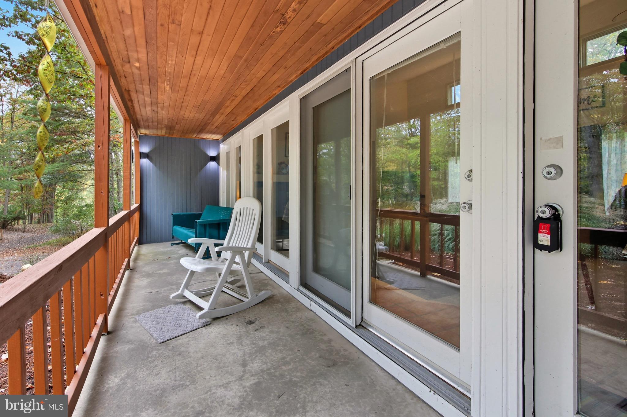 16 Spruce Hollow Road Basye, VA 22842 - Photo 9 of 50 a view of porch with furniture and garden