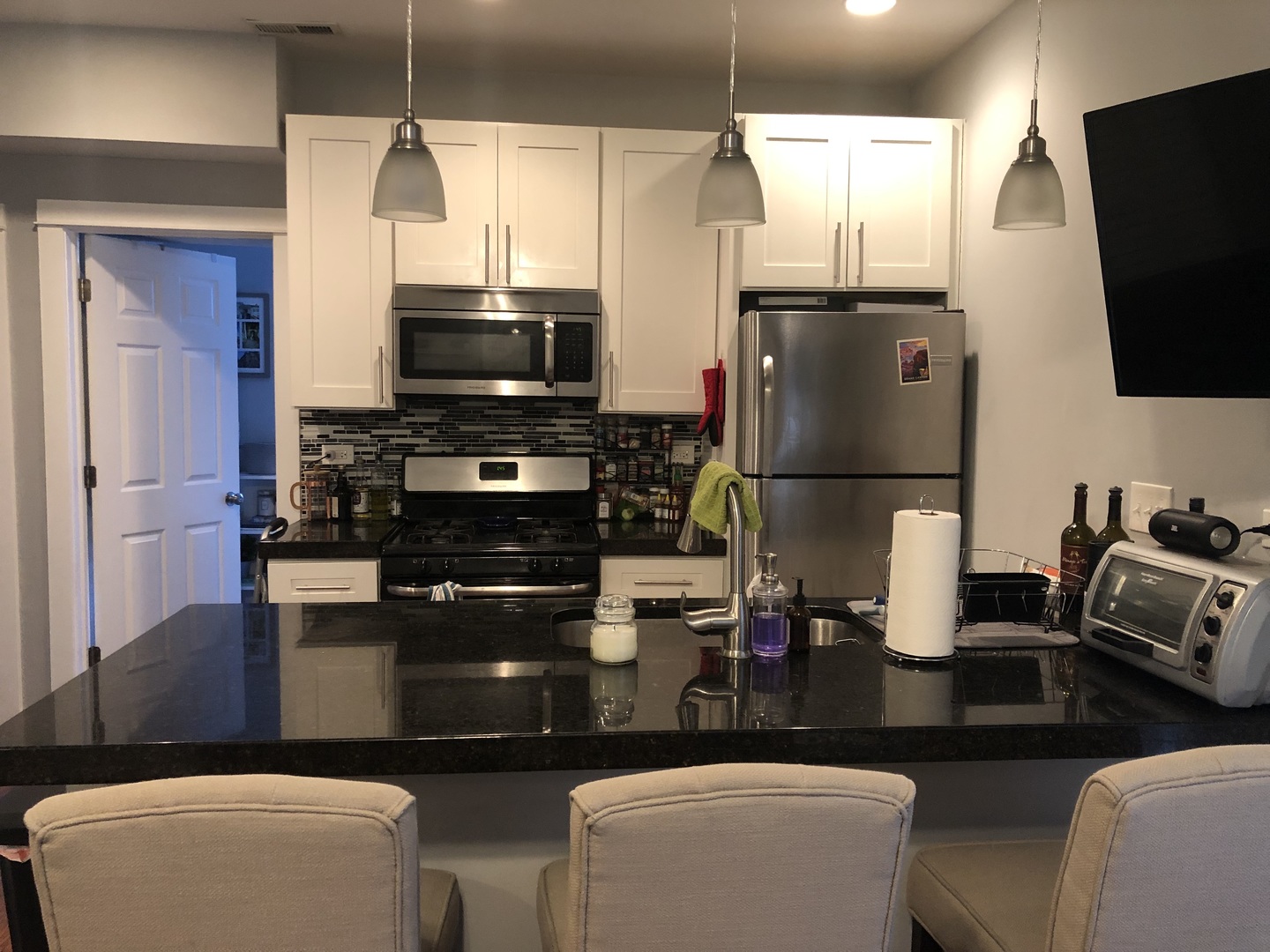 926 West George Street, Unit 3R Chicago, IL 60657 - Photo 2 of 21 a kitchen with stainless steel appliances a stove refrigerator and microwave