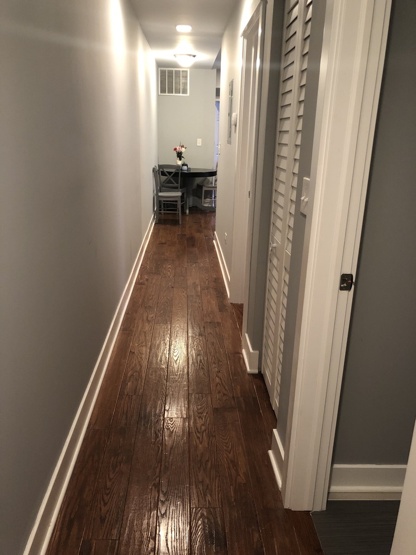 926 West George Street, Unit 3R Chicago, IL 60657 - Photo 9 of 21 a view of a hallway with wooden floor