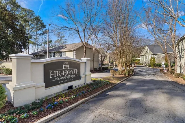 a sign on the side of a street