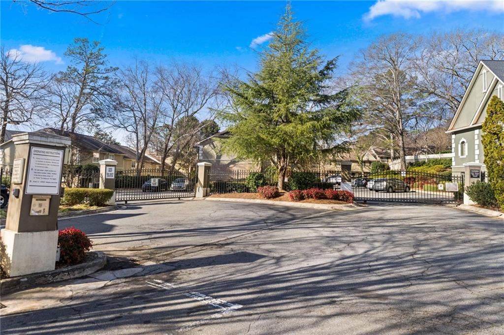 6900 Roswell Road, Unit N5 Atlanta, GA 30328 - Photo 2 of 47 a view of city street with tall trees
