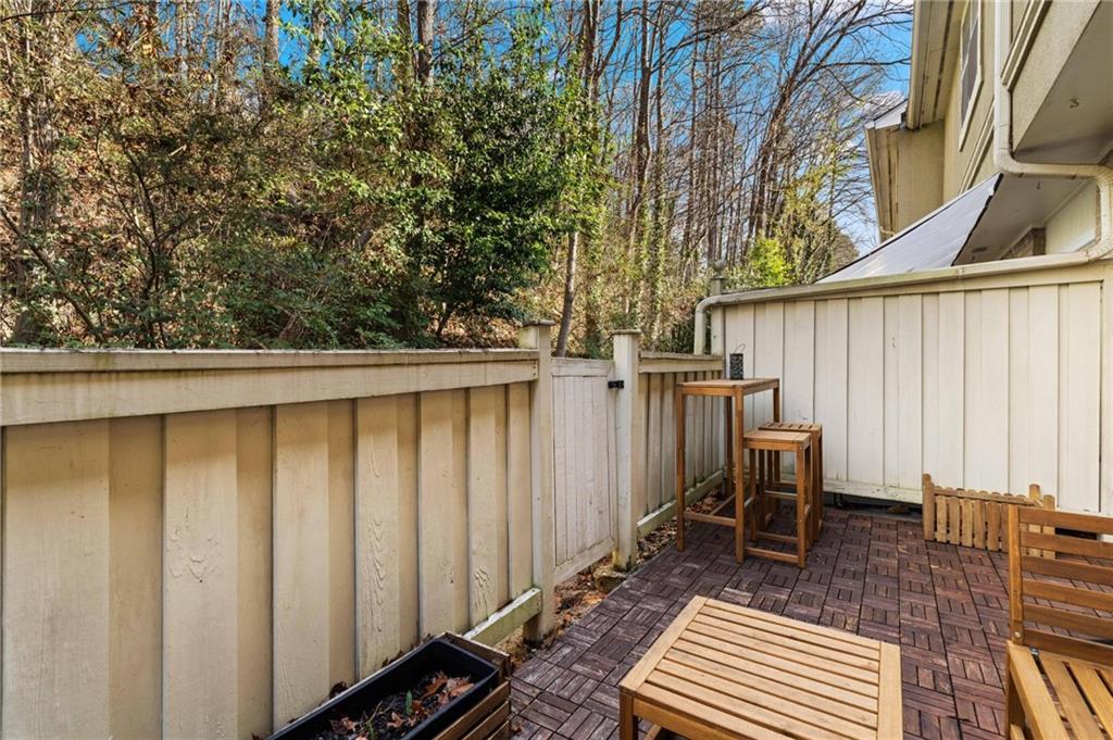 6900 Roswell Road, Unit N5 Atlanta, GA 30328 - Photo 23 of 47 a backyard of a house with table and chairs