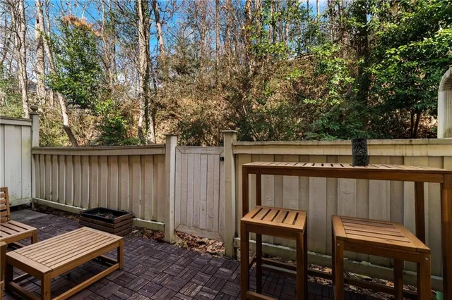 a view of a two chairs in the balcony