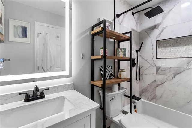 a bathroom with a sink and a window