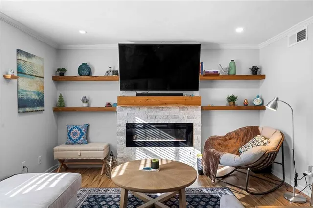 a living room with furniture and a fireplace