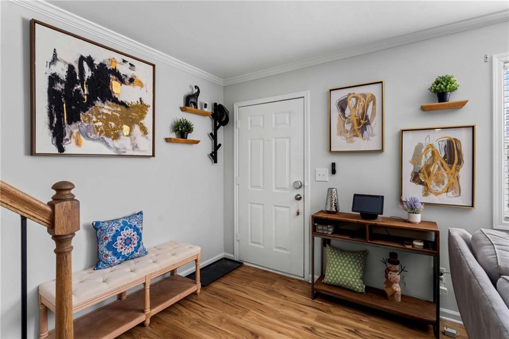 6900 Roswell Road, Unit N5 Atlanta, GA 30328 - Photo 9 of 47 a view of a workspace with furniture and wooden floor