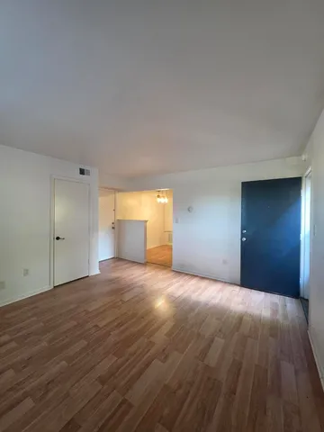 a view of empty room with a fireplace
