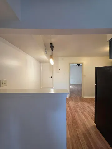 an empty room with wooden floor