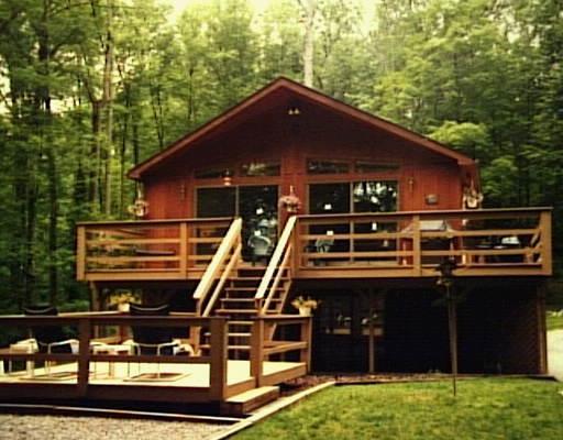 a front view of a house with parking space