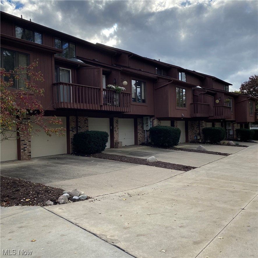 22522 Center Ridge Road, Unit E Rocky River, OH 44116 - Photo 22 of 22 View of building exterior with a garage
