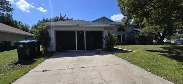 a view of a house with a yard