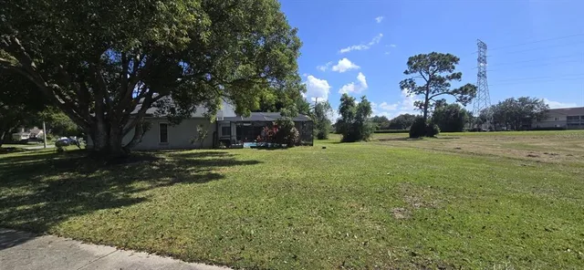a backyard of a house with lots of green space