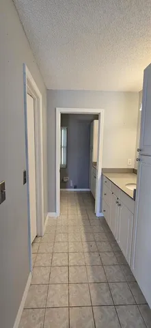 a view of a kitchen with a sink and a stove top oven