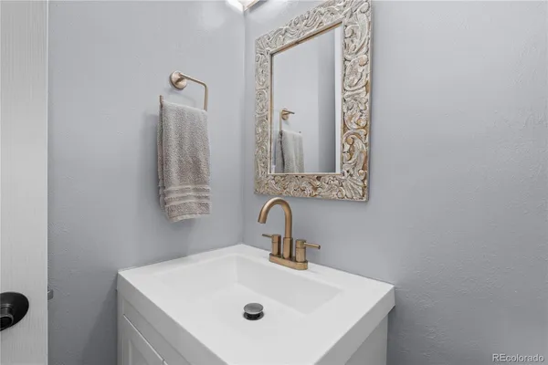 a bathroom with a sink and a mirror