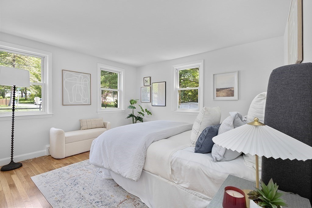 117 Oak Ridge Drive Ayer, MA 01432 - Photo 11 of 26 a bedroom with a bed and wooden floor