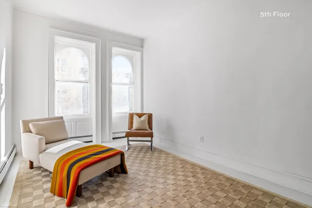 a view of a patio with couches and potted plants