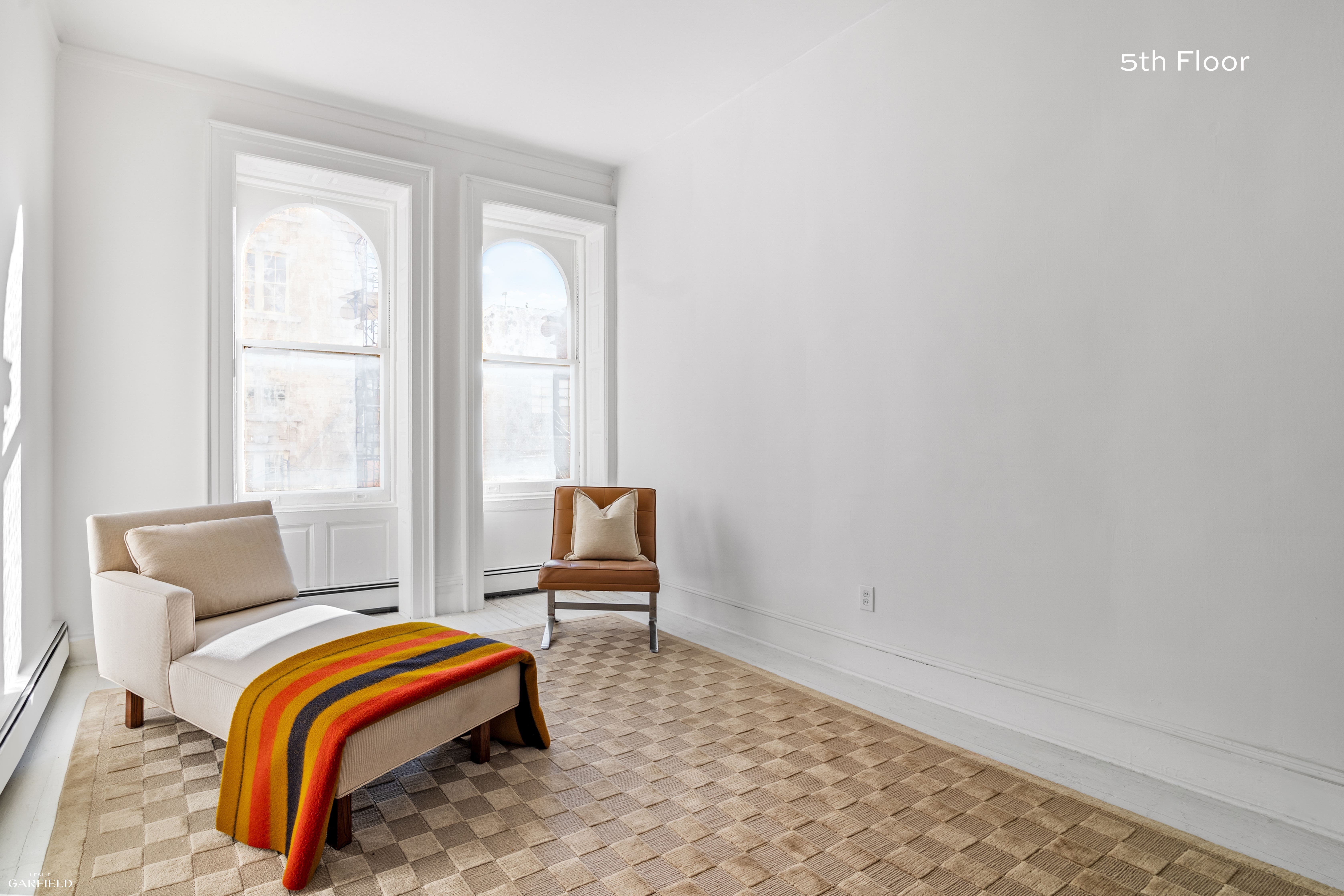 13 West 89th Street Manhattan, NY 10024 - Photo 13 of 17 a bedroom with a bed and a window