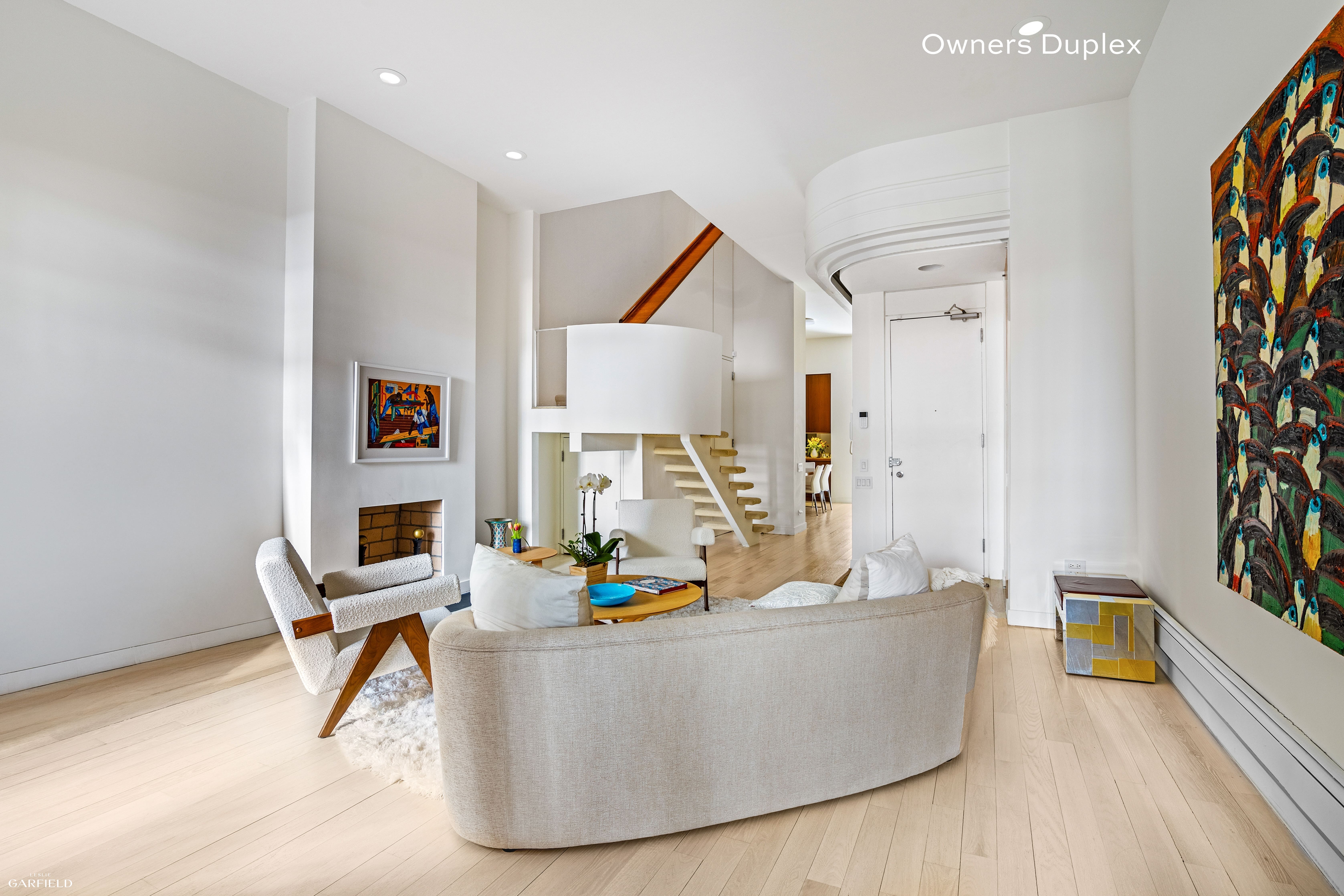 13 West 89th Street Manhattan, NY 10024 - Photo 2 of 17 a living room with furniture and a table