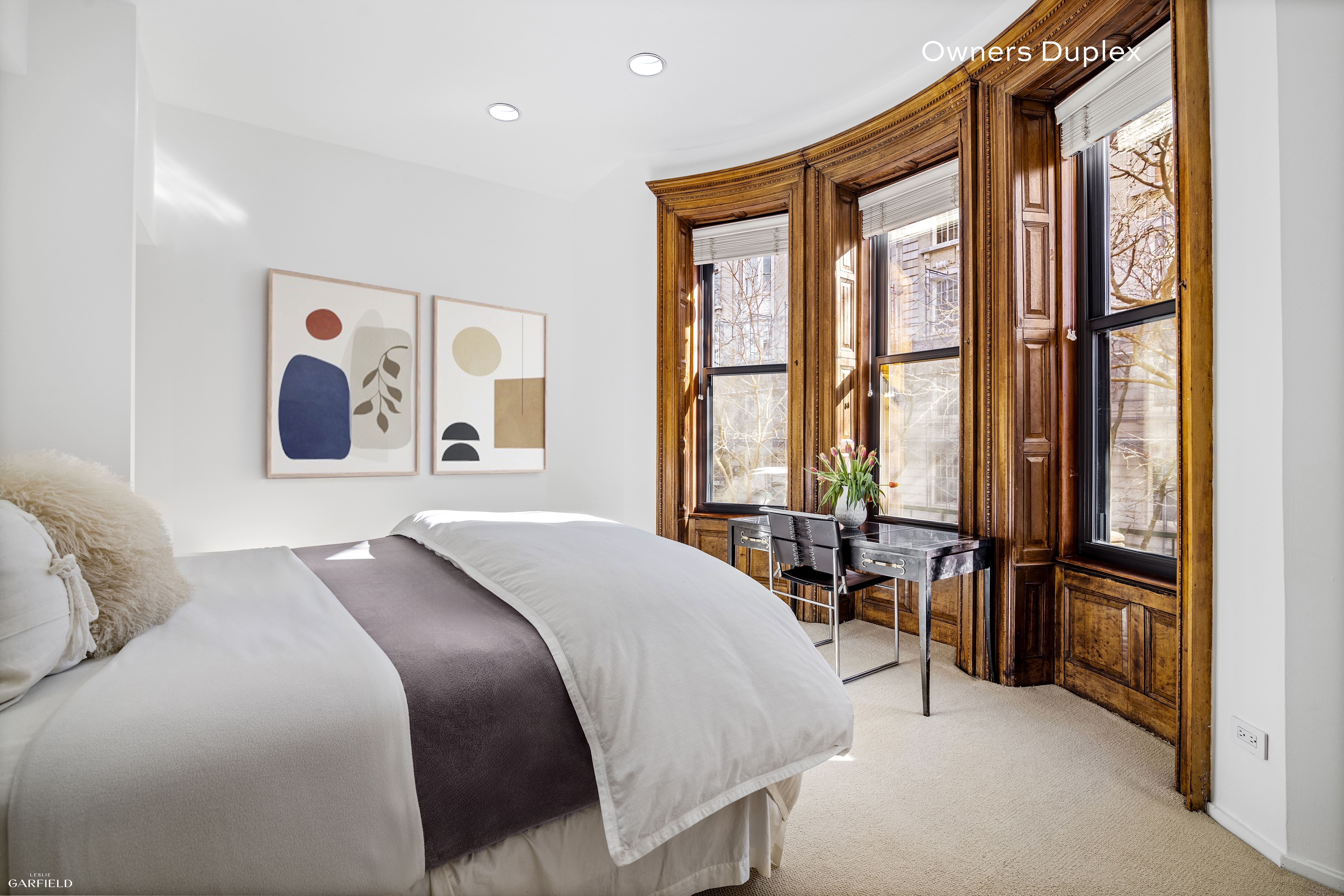 13 West 89th Street Manhattan, NY 10024 - Photo 5 of 17 a bedroom with a bed and a large window
