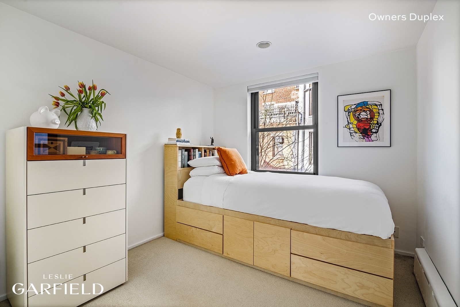 13 West 89th Street Manhattan, NY 10024 - Photo 6 of 17 a bedroom with a bed and a window