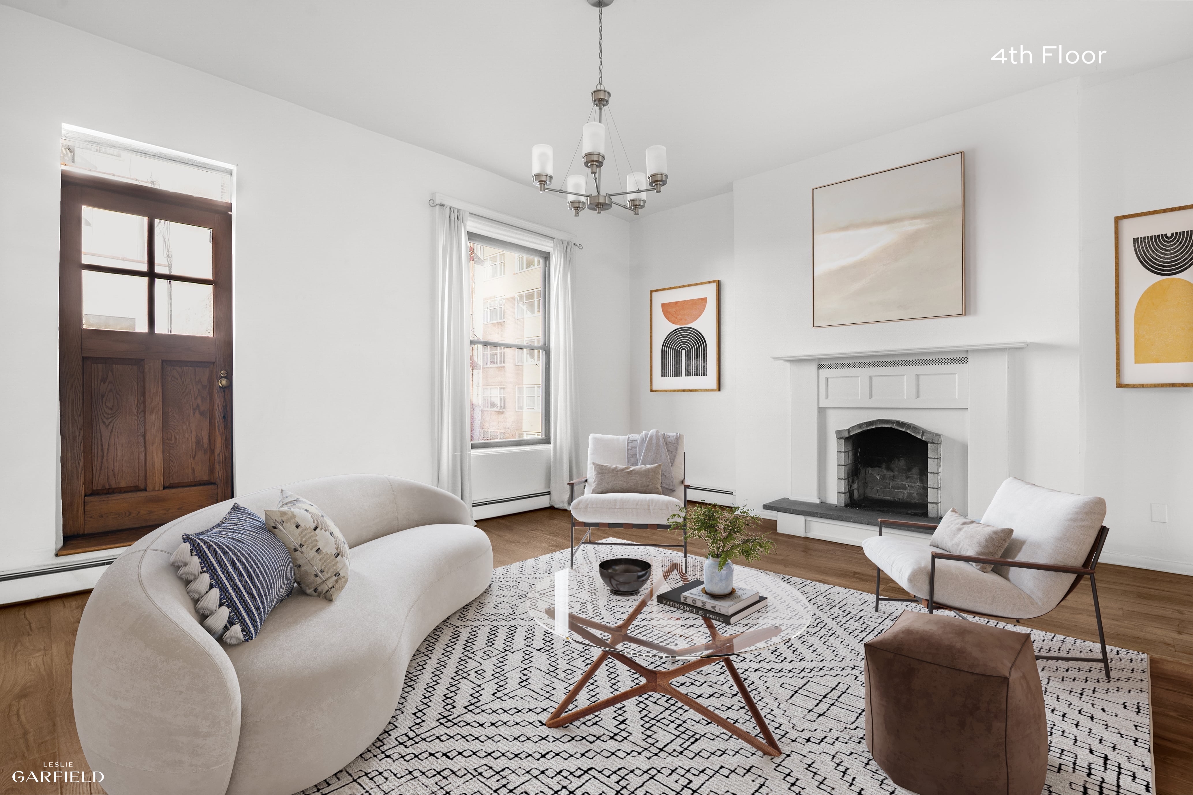 13 West 89th Street Manhattan, NY 10024 - Photo 8 of 17 a living room with furniture a fireplace and a window