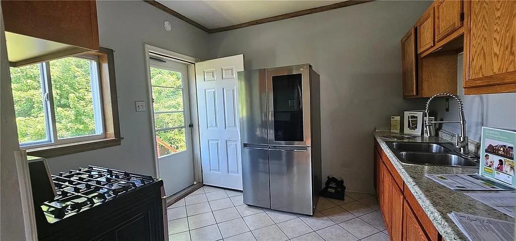 115 North Ray Street New Castle, PA 16101 - Photo 2 of 9 a kitchen with stainless steel appliances granite countertop a refrigerator and a sink