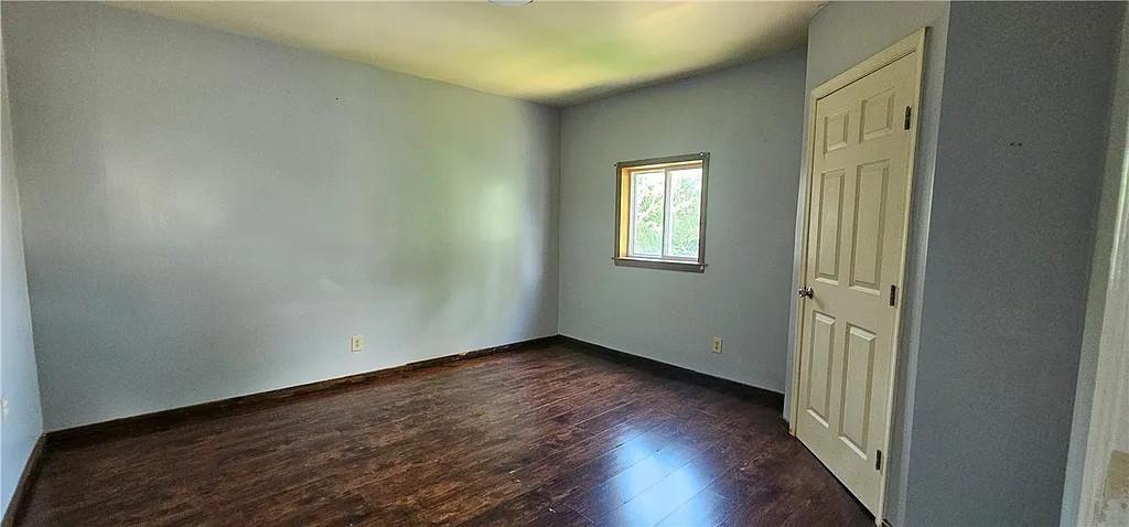 115 North Ray Street New Castle, PA 16101 - Photo 9 of 9 an empty room with wooden floor and windows