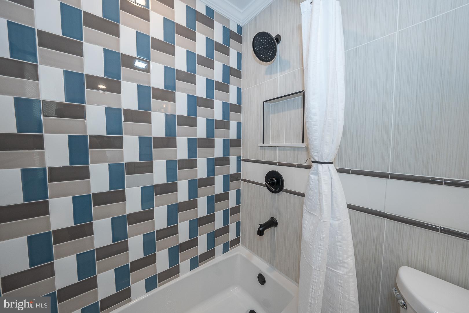 1022 Clover Hill Road Wynnewood, PA 19096 - Photo 15 of 40 a bathroom with a shower toilet and a sink