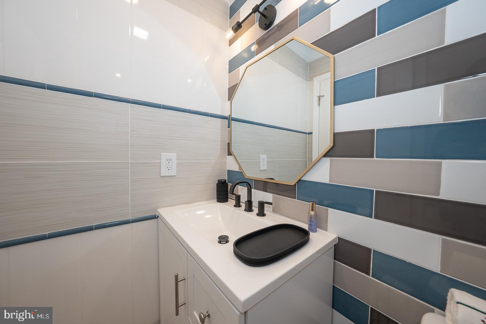 1022 Clover Hill Road Wynnewood, PA 19096 - Photo 17 of 40 a bathroom with a sink and a mirror